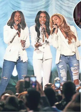  ?? GETTY IMAGES FOR PARKWOOD ENTERT ?? Michelle Williams, Kelly Rowland and Beyoncé perform in 2015. Rowland says she hasn’t asked her former Destiny’s Child bandmates about appearing on Chasing Destiny ... yet.