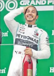  ?? REUTERS ?? ■ Lewis Hamilton celebrates his win in Shanghai on Sunday.