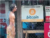  ?? MARVIN RECINOS AFP VIA GETTY IMAGES ?? Stores in El Salvador are accepting bitcoin, which is now a legal tender in the country.