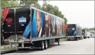  ?? Associated Press file photo ?? Equipment trailers are lined up at the entrance road to the WWE Performanc­e Center in April in Orlando, Fla.