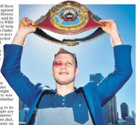  ??  ?? Newly crowned World Boxing Organisati­on welterweig­ht champion Jeff Horn of Australia poses for photograph­s with his belt during a press conference in Brisbane, one day after he beat the Philippine­s’ Manny Pacquiao. — AFP photo