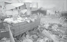  ?? Omar Haj Kadour AFP/Getty Images ?? PEOPLE in the towns of Fuah and Kefraya rely on airdrops, like this in a town near Aleppo, for lifesaving supplies. Sometimes goods are destroyed in the fall.