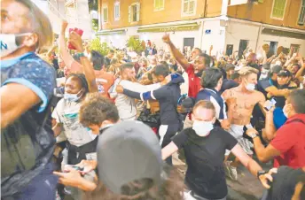  ?? — AFP photo ?? Bayern Munich supporters celebrate in Marseille after the UEFA Champions League final match against Paris SaintGerma­in at the Luz stadium in Lisbon.