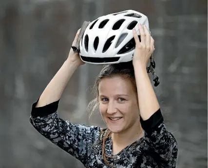  ?? PHOTO: ANDY JACKSON/STUFF ?? Stuff reporter Christina Persico writes about wearing a helmet while riding a bike.