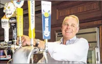  ?? ALLISON TERRY / CHICAGO TRIBUNE ?? Paul Hetterich, president of Constellat­ion Brands’ beer division, demonstrat­es the beer tap in his office suite in Chicago. “We’re sticking to our strategy,” he says.