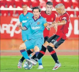  ?? AFP ?? Sporting a new look without the beard but with undiminish­ed ball skills after the three-month break due to Covid-19, Lionel Messi scored and grabbed two assists as Barca beat Mallorca 4-0 on Saturday.