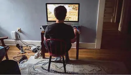  ?? NYT PIC ?? A boy playing Minecraft at his home. A study on screen time featured on ‘60 Minutes’ is sure to alarm parents.