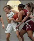  ?? JULIA MALAKIE — LOWELL SUN ?? Billerica’s Taylor Fitzpatric­k, left, and Lowell’s Emerson Webb wrestle for the ball during Billerica’s 55-41 win.