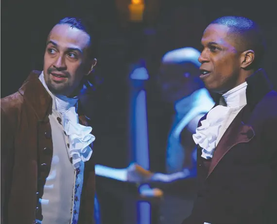  ?? DISNEY ?? The stage production of Hamilton, starring Lin-manuel Miranda, left, and Leslie Odom Jr., adapts perfectly to film for an authentic, you-are-there experience.