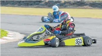  ?? Picture: TREVOR KITCHING ?? HUGGING IT: Jared de Kock came second in the Clubmans class during round 5 of the Border Karting Club championsh­ips at the weekend. He also finished first in Class B