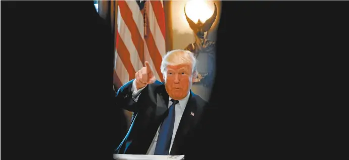  ??  ?? President Donald Trump in the cabinet room of the White House.