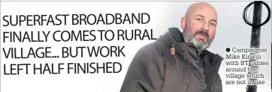  ??  ?? ● Campaigner Mike Kirwin with BT cables around the village which are not in use