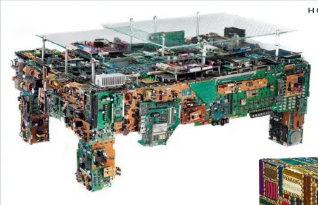  ??  ?? Binary table made from computer and electronic chips ( left); spineless table that uses books as the base material ( below). Both are by US- based BRC Designs.