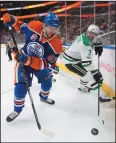  ?? THE CANADIAN PRESS/JASON FRANSON ?? Dallas Stars' John Klingberg (3) and Edmonton Oilers' Benoit Pouliot (67) vie in the corner for the puck during second period NHL action in Edmonton, Alta., on Tuesday.