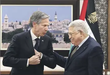  ?? Ronaldo Schemidt Pool Photo ?? SECRETARY OF STATE Antony J. Blinken, left, meets with Palestinia­n Authority President Mahmoud Abbas on Tuesday in Ramallah. Support for a two-state solution is down among Palestinia­ns and Israelis.