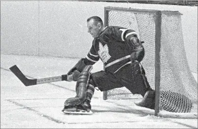  ?? CP PHOTO ?? Toronto Maple Leafs’ Johnny Bower makes a kick save during playoff action against the Montreal Canadiens in Montreal in 1966.