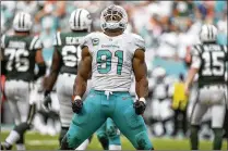  ?? THE PALM BEACH POST ?? Dolphins defensive lineman Cameron Wake leads a unit that could be a dominant force in the league this season. The defensive line has been giving the offense fits in training camp drills.