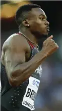  ?? ALASTAIR GRANT/THE ASSOCIATED PRESS ?? Canadian Aaron Brown won his 200-metre heat, but was disqualifi­ed for stepping on the line.