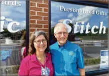  ??  ?? Shop owners Julie and Steve Grice standing outside of their Miamisburg store Classic Stitch.
