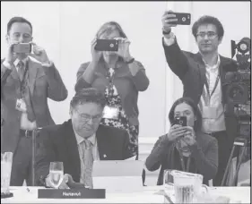  ?? CP PHOTO ?? Nunavut Premier Peter Taptuna is surrounded by media during the Council of Federation meetings in Edmonton.