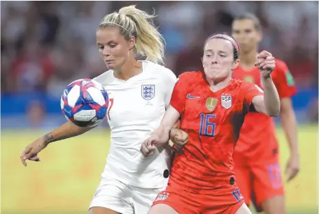  ?? AP PHOTO ?? England’s Rachel Daly, left, challenges for the ball with United States’ Rose Lavelle during the Women’s World Cup semifinal soccer match between England and the United States, at the Stade de Lyon, outside Lyon, France, Tuesday.
