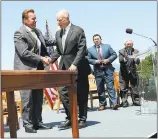  ?? JANE TYSKA — STAFF PHOTOGRAPH­ER ?? Former Gov. Arnold Schwarzene­gger congratula­tes Gov. Jerry Brown as Brown prepares to sign the climate bill AB 398 on Treasure Island in San Francisco in July.