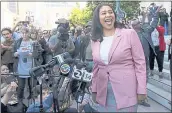  ?? JEFF CHIU — THE ASSOCIATED PRESS ?? London Breed smiles toward supporters before speaking to reporters outside of City Hall in San Francisco on Wednesday. Breed was elected the first AfricanAme­rican woman mayor to lead San Francisco.