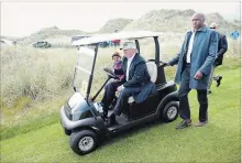  ?? MATTHEW LLOYD BLOOMBERG ?? Donald Trump drives a golf cart at Trump Internatio­nal Golf Links north of Aberdeen, Scotland, in 2016. A Scottish Natural Heritage report says constructi­on of the course damaged legally protected sand dunes.