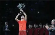  ?? MICHEL EULER - THE ASSOCIATED PRESS ?? Karen Khachanov of Russia raises the trophy after defeating Novak Djokovic of Serbia in their final match of the Paris Masters tennis tournament at the Bercy Arena in Paris, France, Sunday, Nov. 4, 2018.