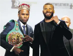  ?? DAVE ABEL / POSTMEDIA NETWORK ?? WBC Light Heavyweigh­t champion Adonis Stevenson, left, with challenger Badou Jack in preparatio­n for Saturday’s title fight at the Air Canada Centre.