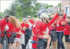  ??  ?? Andrea Haughan finished her 2,100-km cycling trek from Ontario to Pictou County by hugging her biggest fan, Reese Hawkins. Haughan and her husband, Lloyd McLean, did the Ride for Reese in 13 days in honour or Hawkins’ recovery from leukemia.
