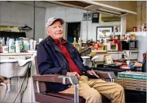  ?? ARVIN TEMKAR/ARVIN.TEMKAR@AJC.COM ?? James “Soapy” Herndon rests Saturday in his chair at Soapy’s Barber Shop in Americus. He has been a close friend to the former president since the 1960s.