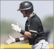  ?? (NWA Democrat-Gazette/Charlie Kaijo) ?? Bentonvill­e third baseman Ethan Arnold celebrates after hitting an RBI double in the fifth inning Saturday against Springdale HarBer in the Class 6A state baseball semifinals at Springdale. More photos are available at arkansason­line.com/515boys6a/