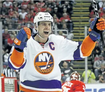  ?? PAUL SANCYA/AP ?? Islanders centre John Tavares celebrates a goal against the Red Wings last week in Detroit.