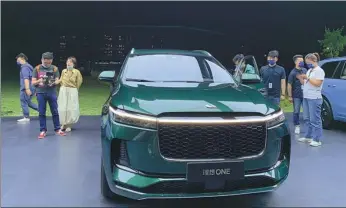  ?? ZHANG DANDAN / CHINA DAILY ?? Li Auto displays its model Li ONE in Beijing. The startup delivered 4,167 vehicles in April, down 62.2 percent from the previous month.