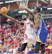  ?? AP ?? Houston Rockets’ Montrezl Harrell shoots as Golden State Warriors Draymond Green defends during their game.—