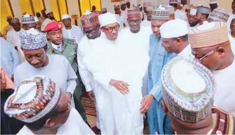  ?? PHOTO: State House ?? President Muhammadu Buhari (middle), shortly after the Juma’at prayer at the Presidenti­al Villa in Abuja on Friday