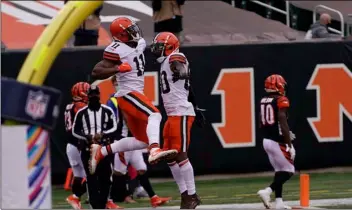  ?? AP Photo/Bryan Woolston ?? Cleveland Browns’ Donovan Peoples-Jones (11) celebrates his touchdown reception with Jarvis Landry (80) during the second half of an NFL football game against the Cincinnati Bengals, on Sunday in Cincinnati.