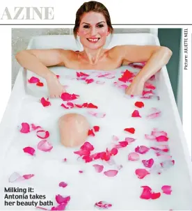  ??  ?? Milking it: Antonia takes her beauty bath