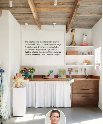  ??  ?? The kitchenett­e is softened by a white cabinet skirt that conceals open storage. A washer and dryer will eventually be installed so Virginia can dye fabrics. Ceiling planks, Barnboard Store; beams, Smash; cabinets, Loyal Creative Design.
TOP RIGHT: Virginia’s Geranium-print wallpaper decorates the bathroom. Pendant, Olde Brick Lighting; wallpaper by Virginia Johnson, Y&Co.; sink, Smash.
CENTRE RIGHT: A steel panel with heavyduty magnets holds up samples of Virginia’s wallpapers. She can also use the system to hang large-scale art canvases. “I would love to paint decorative panels that people could hang in their homes,” she says. Steel panel, The Home Depot Canada; daybed, Guff; easel, Curry’s Art Store.
OPPOSITE, TOP LEFT: A vintage chair re-covered in Lee Jofa’s botanical Althea Print fabric and a potted philodendr­on bring a garden feel indoors. Chair upholstery fabric,
Kravet Canada.
OPPOSITE, TOP RIGHT: Virginia paints, sews and more at a long table bought from an online auction. “I love that I have room to work without having to move all my stuff around,” she says. Table, A.H. Wilkens Auctions & Appraisals; basket, HomeSense; rug, Clarion River Trading Co.