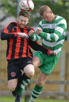  ??  ?? Kevin Bull competes in the air with Bellurgan’s Sean Matthews.