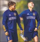  ?? Allen J. Schaben Los Angeles Times ?? JAVIER HERNÁNDEZ, right, jokes with Dos Santos, whose near-bilingual skills work well in the locker room.