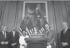  ?? CHIP SOMODEVILL­A, GETTY IMAGES ?? House Democratic leader Nancy Pelosi, center, next to Senate Democratic leader Chuck Schumer, and fellow Democrats.