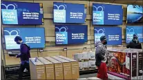  ?? CHARLIE RIEDEL - THE ASSOCIATED PRESS ?? People look at television­s during a Black Friday sale at a Best Buy store on Nov. 26, in Overland Park, Kan. Prices for U.S. consumers jumped 6.8% in November compared with a year earlier as surging costs for food, energy, housing and other items left Americans enduring their highest annual inflation rate since 1982.