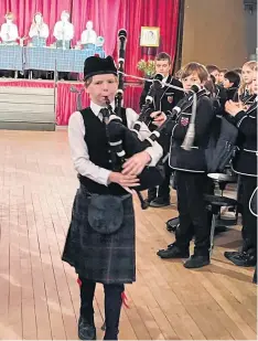  ?? ?? Tradition Piping in the haggis at Morrison’s Academy