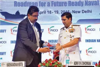  ?? PHOTOGRAPH: FICCI / Indian Navy ?? Harshavard­han Neotia, President, FICCI, with Chief of the Naval Staff Admiral R.K. Dhowan on April 18, 2016