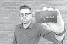  ?? CRAIG MARTYN ?? Craig Martyn, president of My Metal Business Card.com, is buying three new lasers to make products in the United States. Previously, all production was outsourced to China.