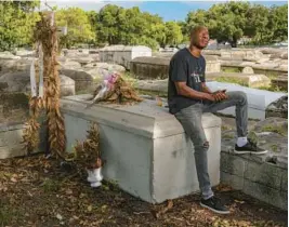  ?? MIAMI HERALD PHOTOS ?? Jessie Wooden found his mother’s grave in the neglected Lincoln Memorial Park Cemetery in Brownsvill­e. He purchased the cemetery, which is the final resting place of upward of 30,000 Black Americans including lynching victims, veterans and even a few millionair­es, in the hope of honoring her and the many others buried alongside her.