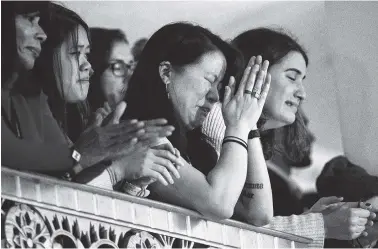  ?? THE ASSOCIATED PRESS ?? Audience members listen as Democratic presidenti­al candidate Hillary Clinton speaks Wednesday in New York, where she conceded her defeat to Republican Donald Trump after the hard-fought presidenti­al election.