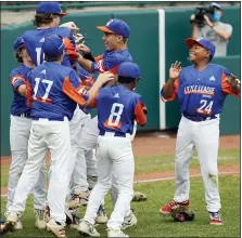  ?? PHOTOS BY TOM E. PUSKAR — THE ASSOCIATED PRESS ?? Taylor North celebrates its 2-1semifinal win over Honolulu, Hawaii at the Little League World Series on Saturday.